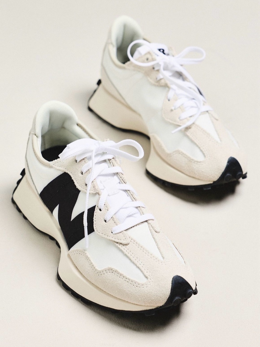 New Balance 327 sneakers in a sea salt, white, and black colorway Women’s 9